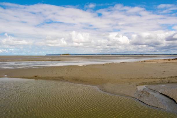 istock View from the beach with clouds at Mont Saint Michel 1272998356