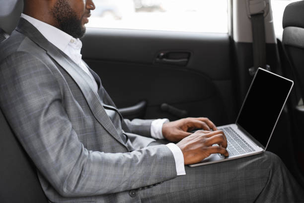 istock African american businessman working on laptop with blank screen 1273000336