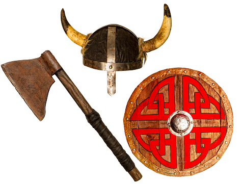 rusty battle ax wooden shield and horned viking helmet