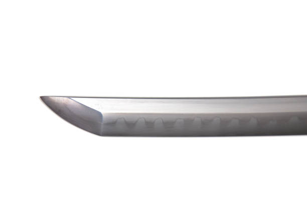 istock Japanese sword blade (made in China) on white background. Soft focus The blacksmith forged several folds until several layers were formed. Can be seen clearly on the surface. 1273003216