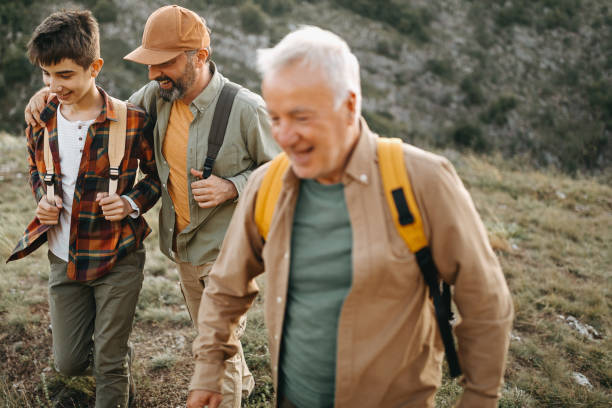 istock Three generations males enjoying hiking tour 1273003337