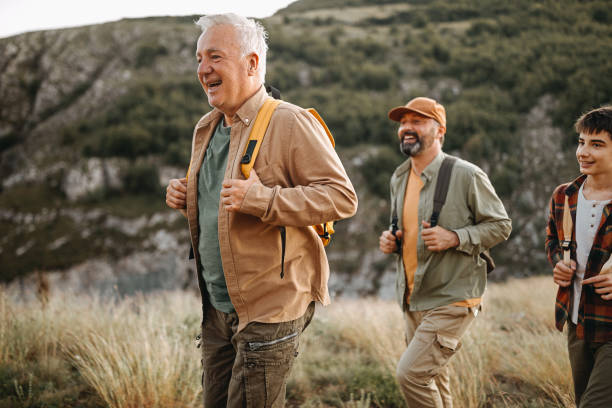 istock Three generations males enjoying hiking tour 1273003385