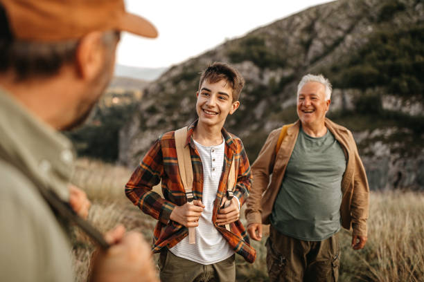 istock Three generations males enjoying hiking tour 1273004595
