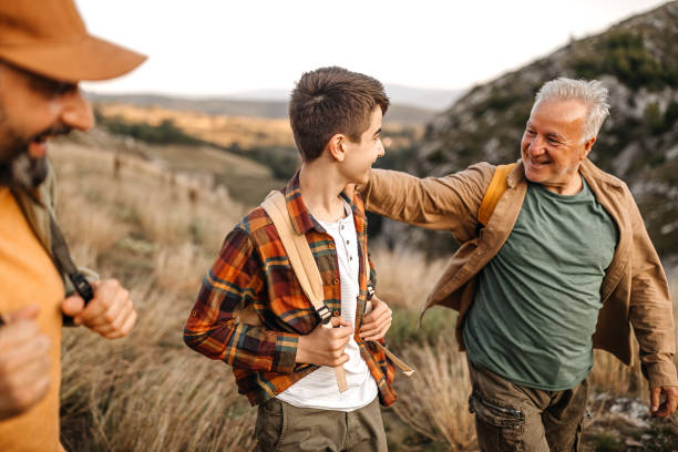 istock Three generations males enjoying hiking tour 1273004760