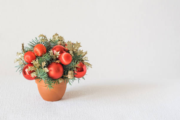 istock Small and beautiful winter festive composition with red ornaments and fir-tree branches on white background. Copyspace. selective focus. Christmas and new year 1273004911