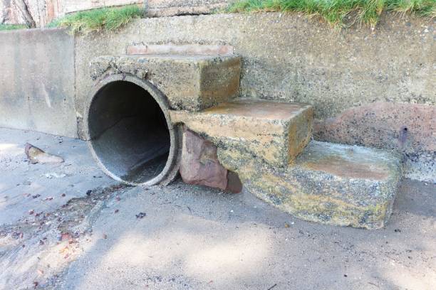 istock Concrete sewer with stairs to the beach. Water drainage hole. 1273005335