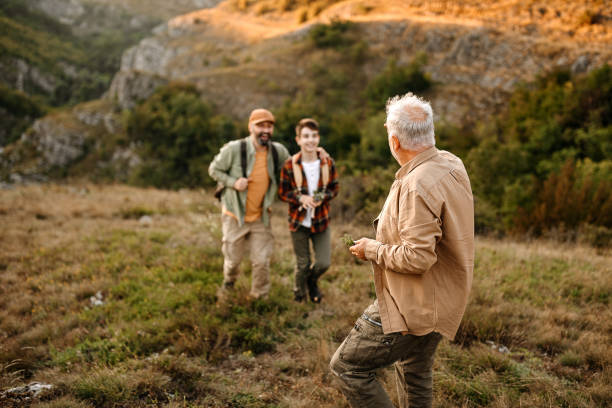 istock Three generations males enjoying hiking tour 1273005368