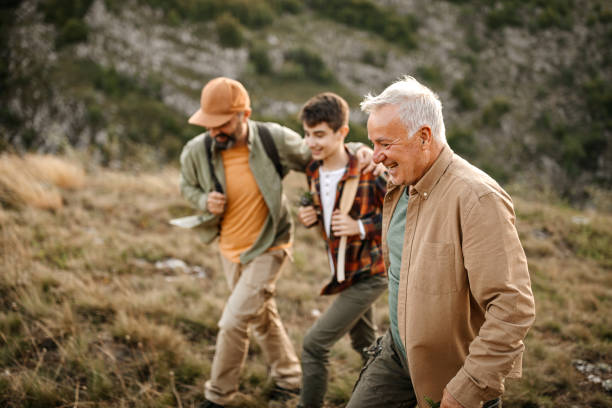 istock Three generations males enjoying hiking tour 1273005529