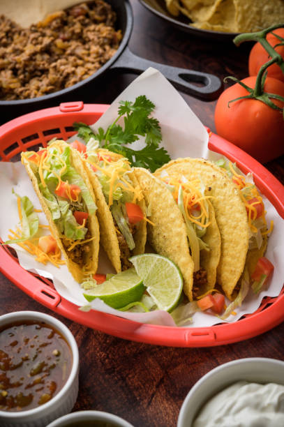 hard shell taco in red plastic basket