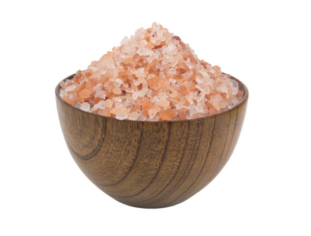 istock Himalayan pink rock salt in bowl isolated on white background 1273007492