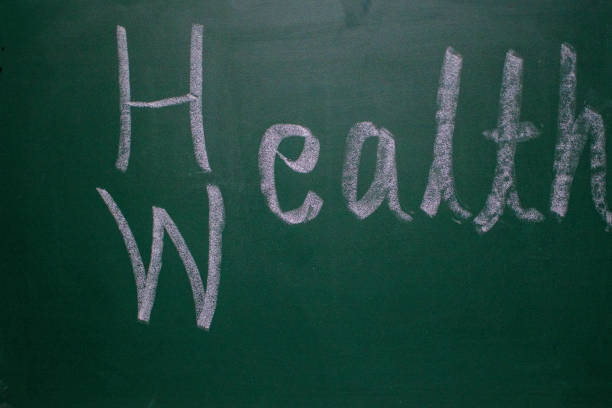 istock Green board writing with white chalk stick - Health is wealth 1273008159