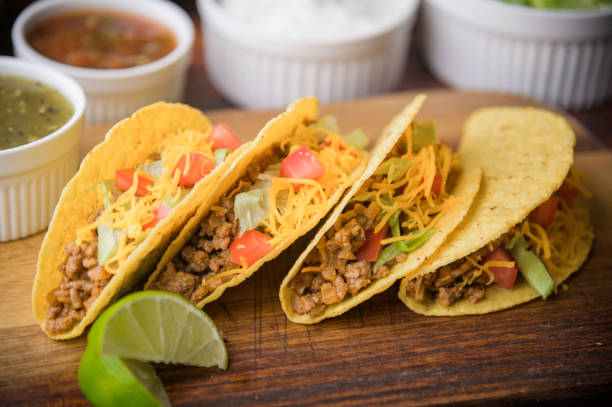 istock hard shell taco on wooden cutting board 1273008189
