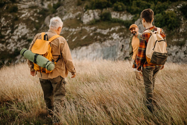 istock Three generations males admiring view on a picnic 1273008692