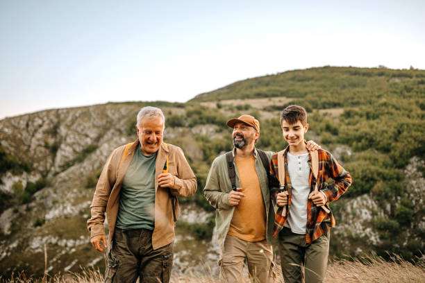 istock Three generations males admiring view on a picnic 1273008827