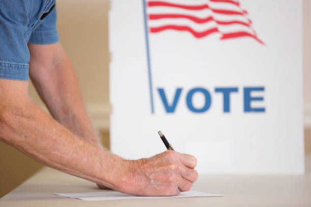 istock Voters at Polling Place 1273008998