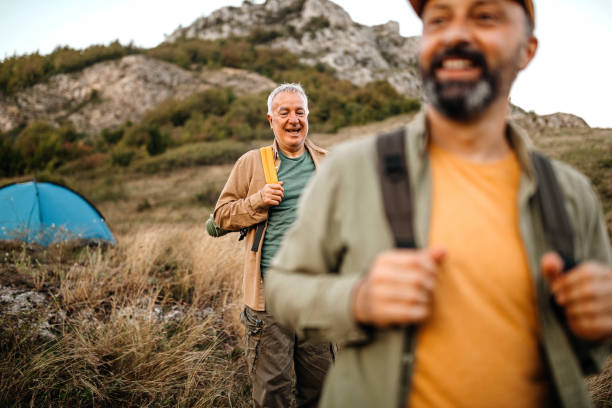 istock Elderly father with adult son on a picnic 1273009128