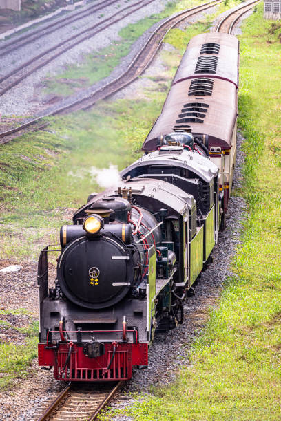 istock Steam train locomotive approaching a station. 1273009132