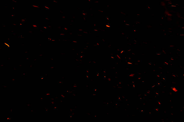 istock The floating light and sparkle of the fire in the dark background. 1273010100