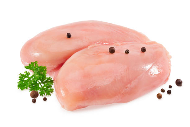 istock Raw chicken fillet with parsley and peppercorns isolated on white background 1273010345