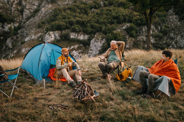 istock Three generations males enjoying camping adventure 1273010412