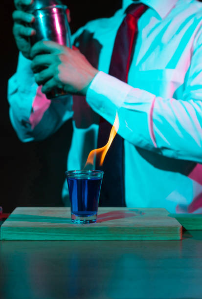 istock Bartender preparing alcoholic drink with a cocktail shaker at the bar. 1273010562