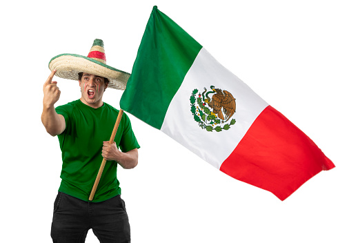 Young patriot Mexican with a ranger hat and a Mexican flag. Shouting of emotion in Independence Day