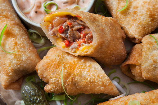 Philly Cheese Steak Egg Rolls with Onions, Roasted Red Peppers and a Spicy Mayo Dipping Sauce
