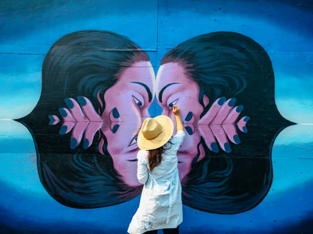 istock Female mural artist at work 1273016285