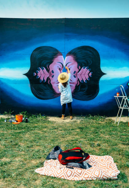 istock Female mural artist at work 1273016296