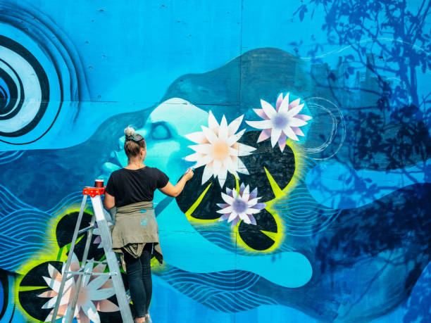 istock Female mural artist at work 1273016891