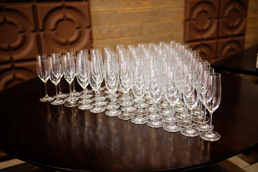 Shine crystal glasses shot on brown wooden table