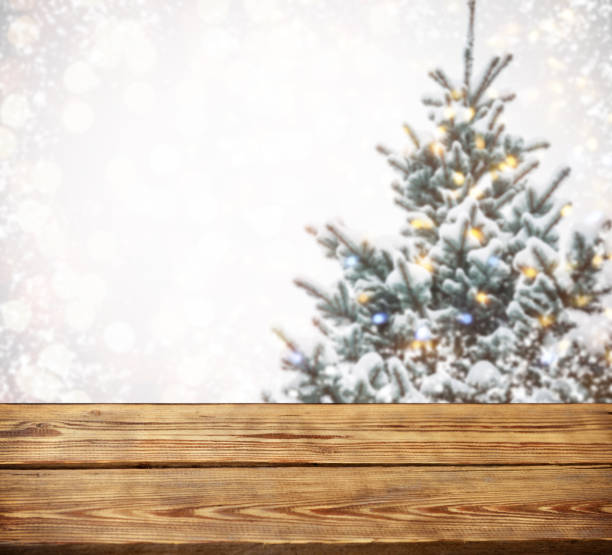 istock Christmas tree branches with wooden background 1273017135