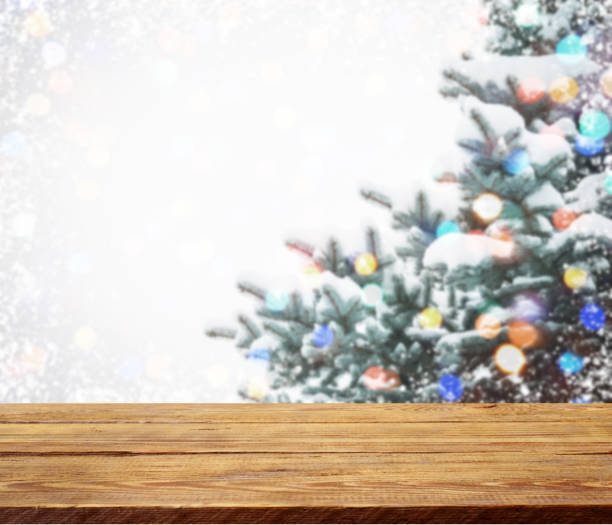 istock Christmas tree branches with wooden background 1273017451