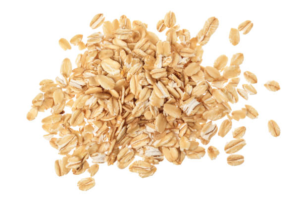 istock oat flakes isolated on white background. Top view 1273017801