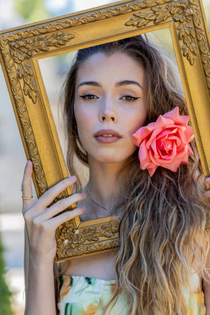 istock Advertising model posing with gold frame like an oil painting 1273018571