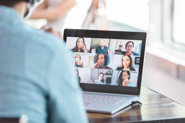 istock Unrecognizable man wears mask and video conferences in office 1273035427