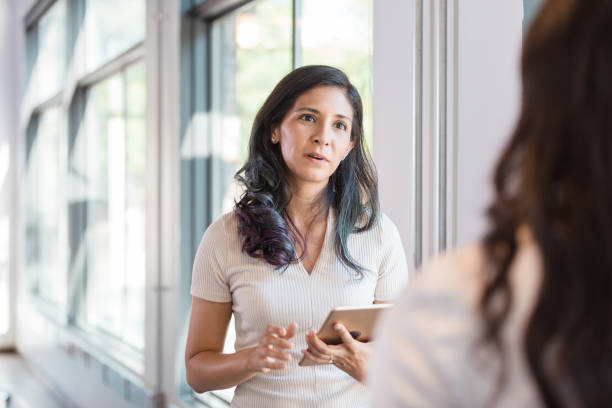 istock Serious young adult manager speaks with unrecognizable employee 1273035628