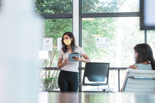 istock Businesswoman gives presentation 1273038574