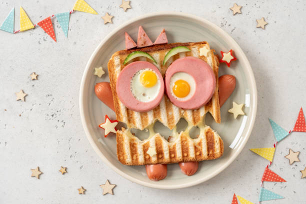 istock Monster sandwich with sausage, eggs and cheese on plate. 1273039538