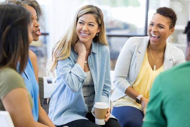 istock Teachers laugh and joke at meeting 1273041054