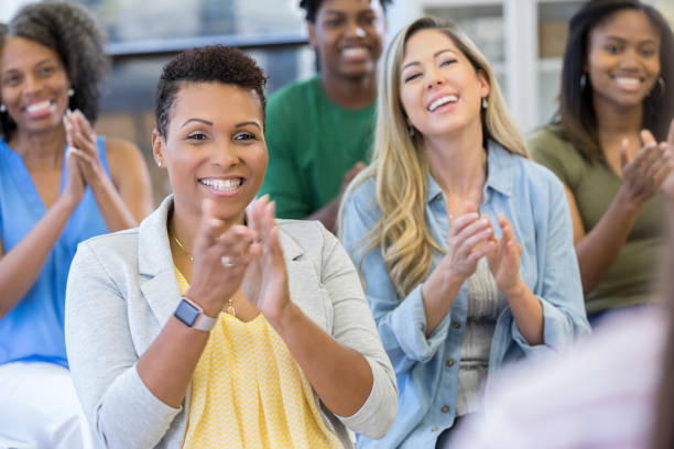 istock Audience applauds unseen speaker 1273041080