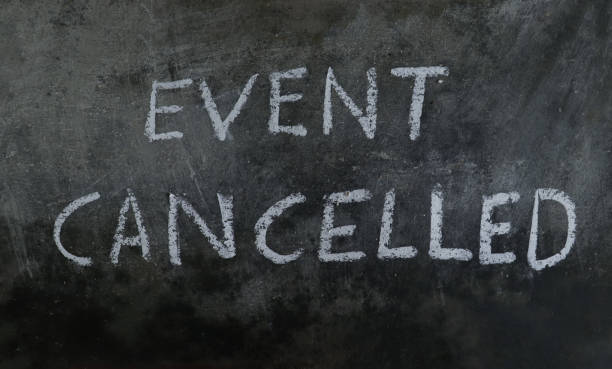 istock Event Cancelled Phrase Written on Blackboard with White Chalk 1273051401