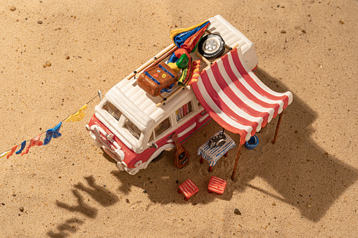 Fictional Vintage motor home camping on beach - Miniature