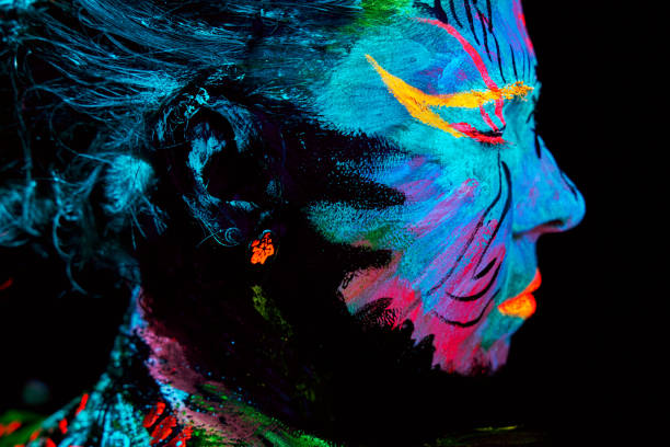 istock neon paint creative glowing UV portrait 1273059652