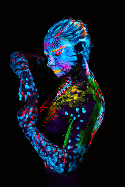 istock neon paint creative glowing UV portrait 1273060830