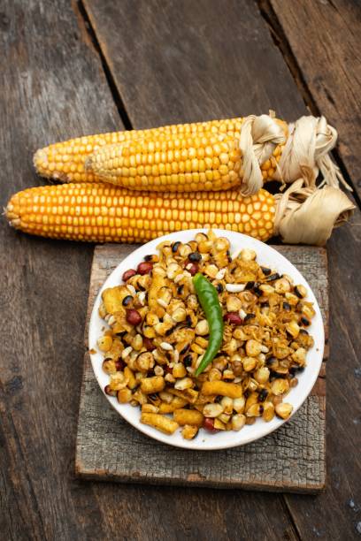 istock Spicy Corn Kernel or Maize Seeds in a Plate with Dry Maize Isolated on Wooden Background 1273062197