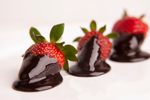 strawberries dipped and covered in dark semisweet chocolate fondue