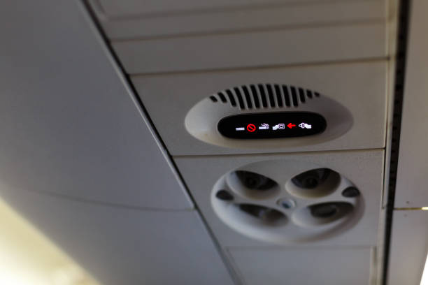 istock Overhead vents and lights in an airplane. 1273067846