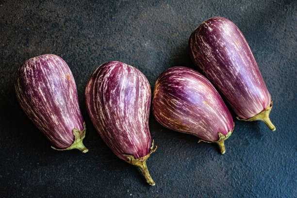 istock eggplant fresh vegetables on the table portion size view copy space for text keto or paleo diet food background rustic 1273081274