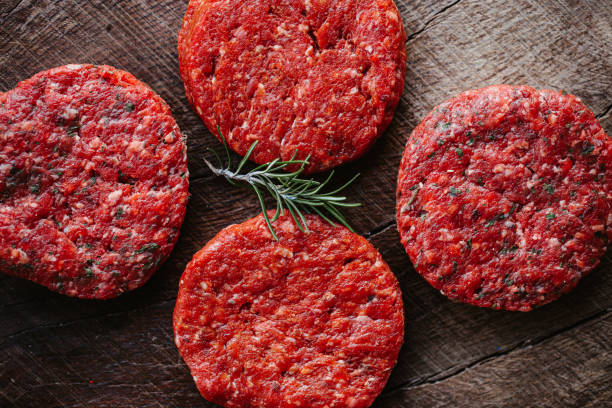 Raw hamburger from Black Angus meat Raw hamburger from Black Angus meat, part of an E+ and S+ series spanish hamburger stock pictures, royalty-free photos & images